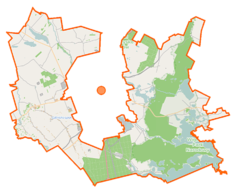 Mapa konturowa gminy wiejskiej Suwałki, na dole po prawej znajduje się owalna plamka nieco zaostrzona i wystająca na lewo w swoim dolnym rogu z opisem „Wigry”