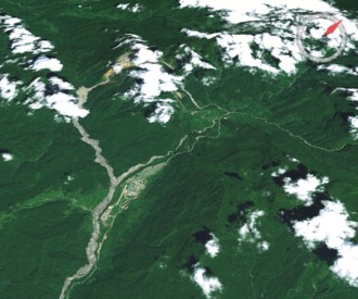The Ok Tedi River is contaminated by tailings from a nearby mine. Tabubil-world wind.png