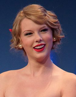 American country pop singer Taylor Swift had five albums reach number one: Speak Now, Red, 1989, Reputation and Lover, and has spent 14 weeks at number one. Taylor Swift 2, 2011.jpg