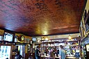 ☎∈ The Eagle pub in Cambridge with graffiti of World War II airmen covering the ceiling.