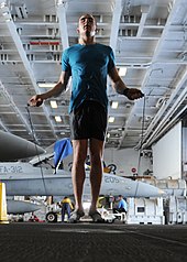 Basic jump technique US Navy 101004-N-6427M-149 Airman David Hall, from Buffalo, N.Y., jumps rope during a training session in the hangar bay aboard the aircraft carrie.jpg