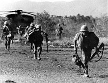 2nd Battalion, 9th Marines evacuate a damaged helicopter during the Mayaguez incident Usmcmayaguez.jpg