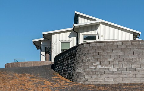 White house with stone wall in Holländaröd, Lysekil, Sweden