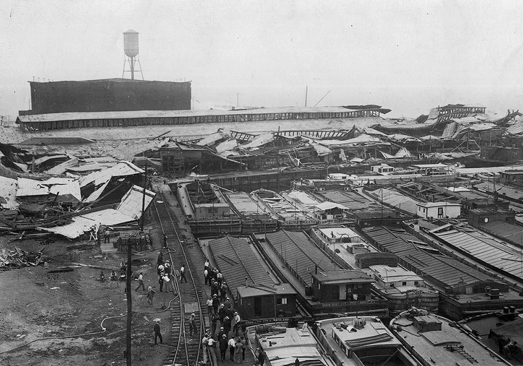 Wrecked warehouses and scattered debris after the Black Tom Explosion, 1916