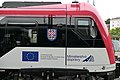 Znak Moravy, vlajka Evropské unie a logo ministerstva dopravy na jednotce řady 530 „Moravia“ (Pálava)