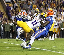 Thomas being tackled in a game against the Florida Gators in 2023 111123 LSU Tigers vs Florida State Gators 145 (53547359343).jpg