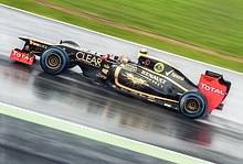 Formula One team Lotus F1 carrying a special livery to promote The Dark Knight Rises at the 2012 British Grand Prix 2012 British GP - Lotus.jpg