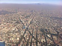 Situated in a valley, and relying heavily on automobiles, Mexico City often suffers from poor air quality. AerialViewMexicoCity.jpg