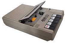 A Bigston-based 410 Program Recorder, the first model sold. The Day-Glo orange sticker inside the tape area makes the tape position more visible. Atari 410 Bigston lid open.jpg