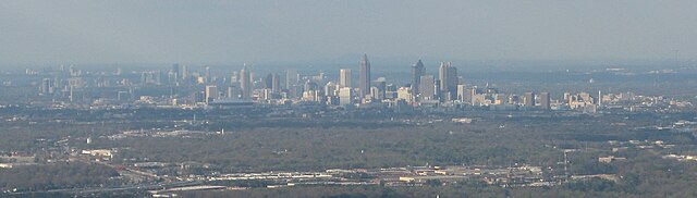 The skylines of Downtown, Midtown, Buckhead (all within the city of Atlanta), and Perimeter Center viewed from the southwest near Hartsfield–Jackson A