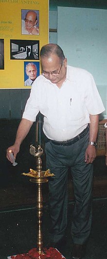Biplab Roy Choudhury lighting the lamp to inaugurate a photo exhibition of Lifetime Achievement Award-winning noted photo-artist, in Kolkata. The Director, Photo Division, Ministry of Information & Broadcasting.jpg
