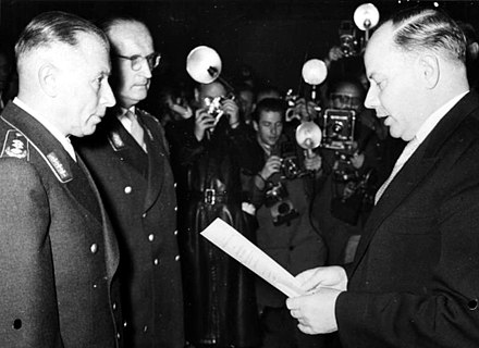 Generals Adolf Heusinger and Hans Speidel being sworn into the newly founded Bundeswehr by Theodor Blank on 12 November 1955