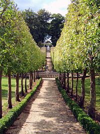 The Four seasons Garden and distant faux waterfall, the creation of the present Lord Faringdon. Buscot Park 7.jpg