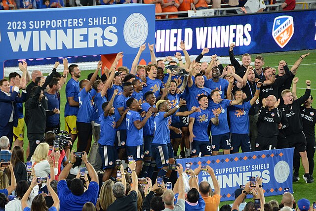 Captain Luciano Acosta holds up the Supporters' Shield after Cincinnati clinched it in 2023.