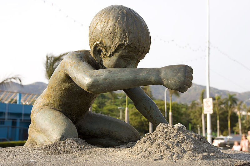 File:Child in the sand (2424678080).jpg