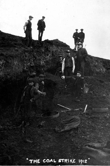 People picking coal to heat their homes Coal Picking At Apedale, Newcastle-under-Lyme.png