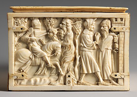 Knight saving a woman from a wild man, ivory coffer, 14th century