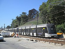 Line 5 LRVs manufactured by Bombardier, used for testing, parked at Brentcliffe portal in September 2021 Crosstown LRVs used for testing parked at Brentcliffe portal.jpg