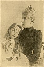 A widow and her daughter in traditional mourning attire. Crown Princess Stephanie of Belgium and her daughter Elisabeth.jpg