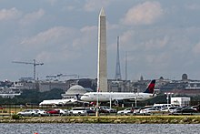 Ronald Reagan National Airport in Arlington, Virginia with Washington, D.C. seen in the background. DCA and Washington VA1.jpg