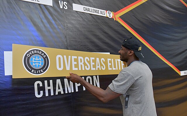 Justin Burrell advancing Overseas Elite's name on the bracket after winning the 2017 championship