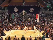 Action at the Osaka Prefectural Gym during the 2006 tournament. Dohyo.JPG