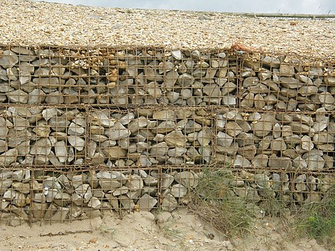 Gabion, welded wiremesh filled with stone.