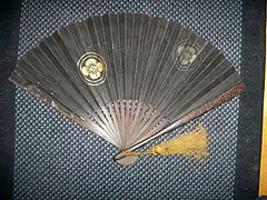 Antique Edo period Japanese (samurai) gunsen fan with wood ribs and an iron outer cover.