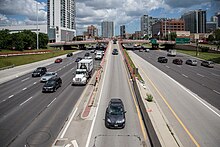 Image depicts how development in urban areas can limit dispersal. I-90-94 Entrance at Madison Street, Chicago (14560285196).jpg