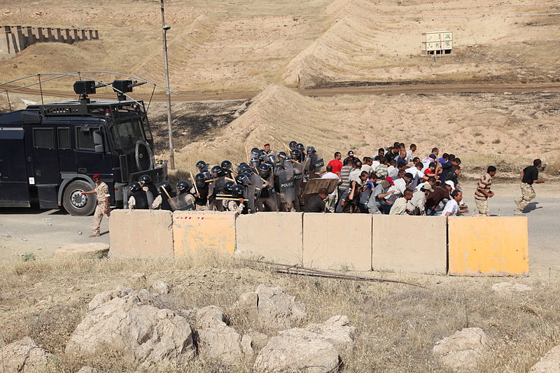 File:Iraqi federal police officers attempt to stop a crowd of protesters from entering a checkpoint during a training session as part of Operation Iron Lion at Ghuzlani Eagle Training Site on Contingency Operating 110626-A-ES591-009.jpg