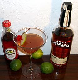 A bottle of blended apple brandy, along with a Jack Rose, a cocktail made with applejack Jack Rose Cocktail.jpg