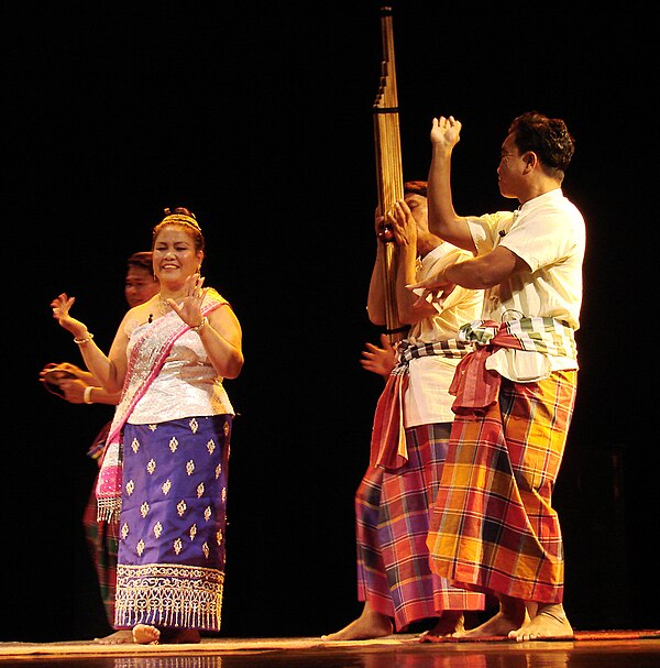 Mor lam performance-the men are playing the khene and wearing pha sarong