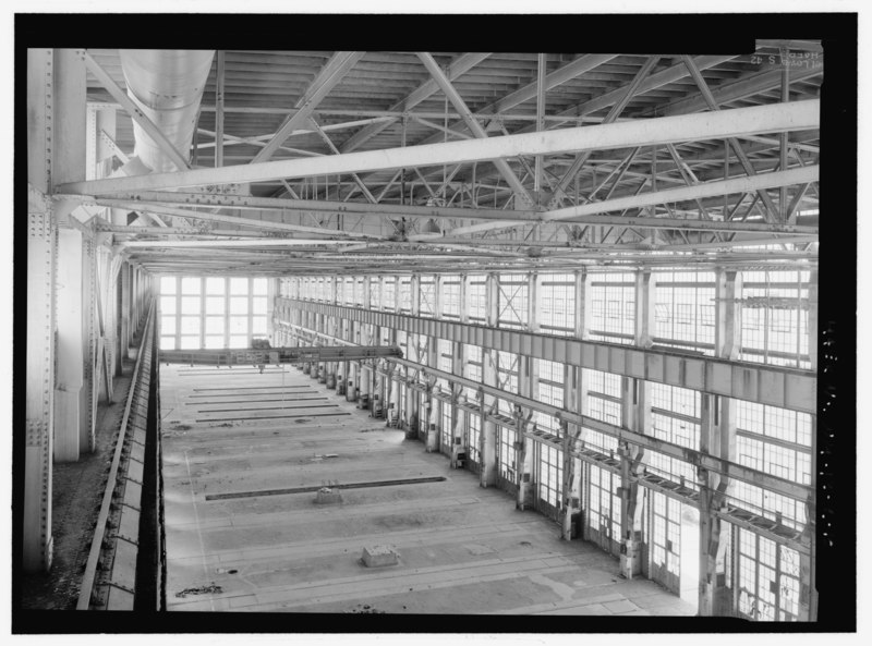 File:Looking west at Machine Shop (Bldg. 163) north bay interior. Note the Shaw 15-ton bridge crane and pits between the rails of several tracks - Atchison, Topeka, Santa Fe Railroad, HAER NM-12-C-10.tif