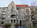 Apartment building in half-open development