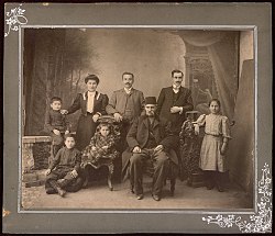 Mihail Kyulyumov (sitting) with his sons Pancho and Petar and Petar's family in Thessaloniki, 1905.jpg