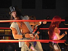 Hoyt in The Rock 'n Rave Infection with Christy Hemme Motor City Machine Guns vs.The Rock and Rave Infection.jpg