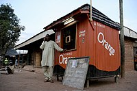 Orange phone booth, Central African Republic, March 2009 (8406177946).jpg
