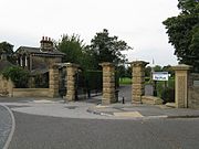 The Cliffe Road entrance gates and lodge* (1861).