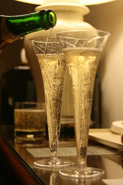 File:Pouring two champagne glasses.jpg