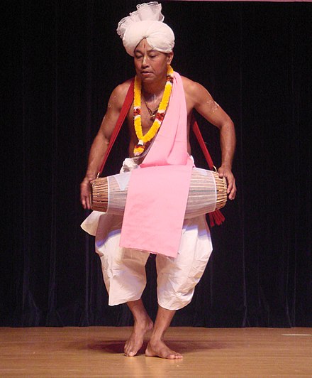 A traditional Pung cholom performer from Manipur. Pung cholom performer, Manipur.jpg