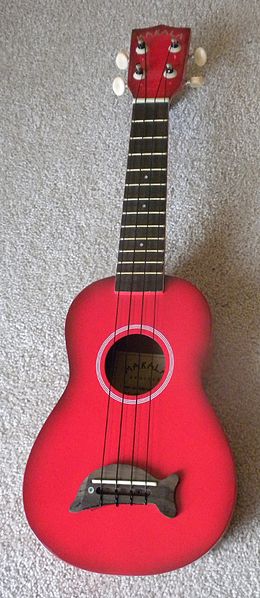 A modern red ukulele
