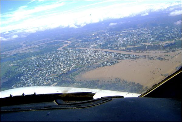 Rockhampton seen from the air on 31 December; the Fitzroy River can be seen to have burst its banks