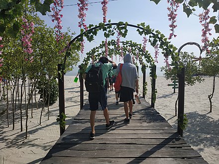 The entrance of the Romance Beach in Medan, using Sakura and spring-like decor, evoking a romantic sense as its name suggests.