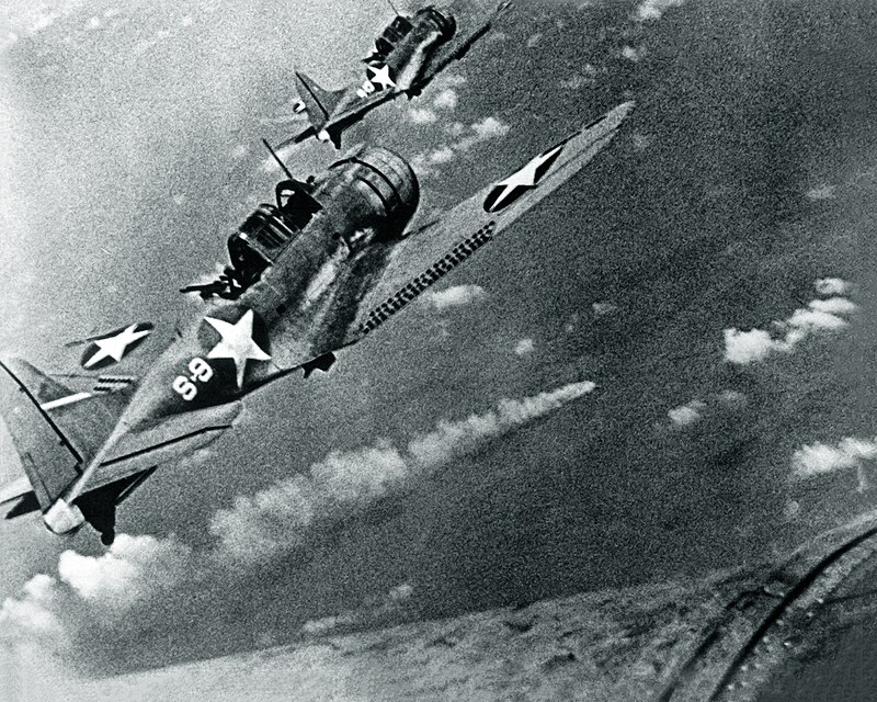 SBD-3 Dauntless bombers of VS-8 over the burning Japanese cruiser Mikuma on 6 June 1942.jpg