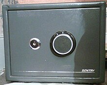 A SentrySafe safe; requires a combination and a four-way key SentrySafe.jpg