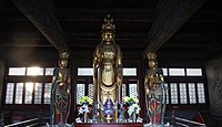 Statue of Shiyimian Guanyin flanked by two attendant bodhisattvas in Huayan Temple (華嚴寺); Datong, Shanxi, China