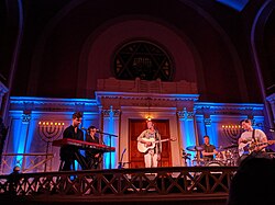 St. Lucia between sets at a performance at the Sixth & I Historic Synagogue in Washington, DC St. Lucia performing at Sixth & I Synagogue, Wash DC 20 may 2019 2.jpg
