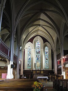 Interior looking towards the altar, prior to the removal of pews and addition of glass partitions St Thomas Haymarket Interior.jpg