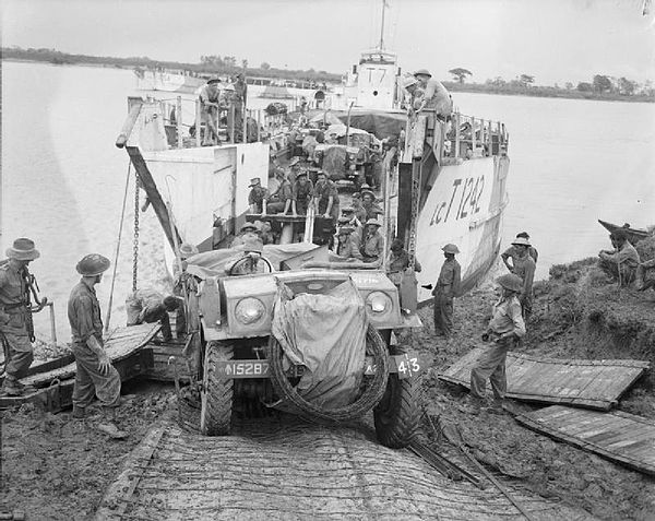 A field gun is bought ashore at Elephant Point, 2 May 1945.