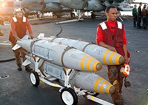 US Navy 021112-N-9593M-034 Aviation Ordnancemen prepare to move three Guided Bomb Units.jpg